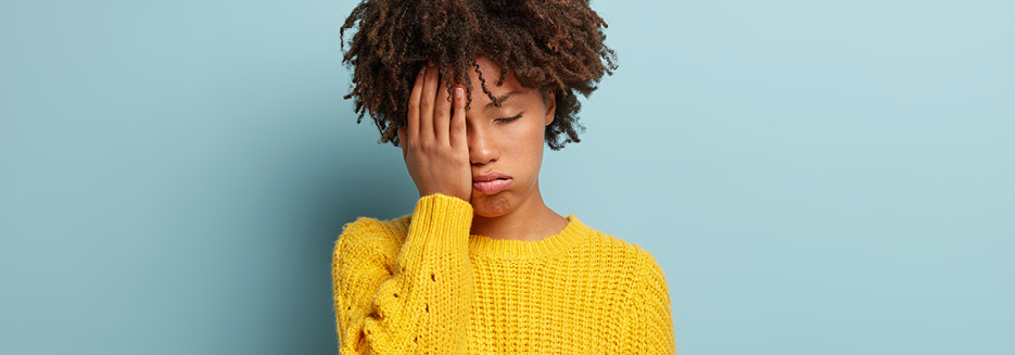 Tired Woman with hand on her face