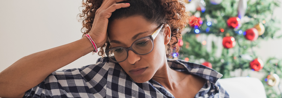 Woman looking depressed at Christmas time