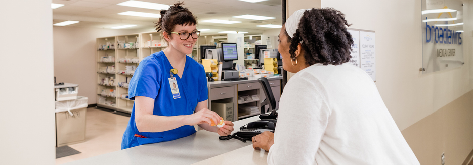 Pharmacist consulting with patient