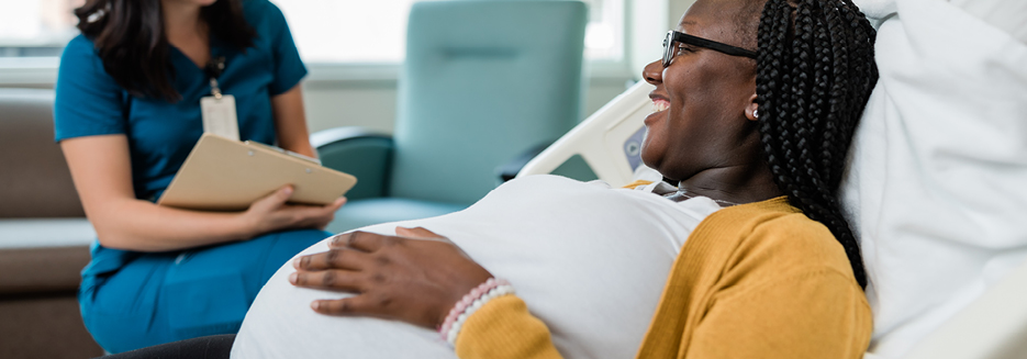 Pregnant woman with hand on belly